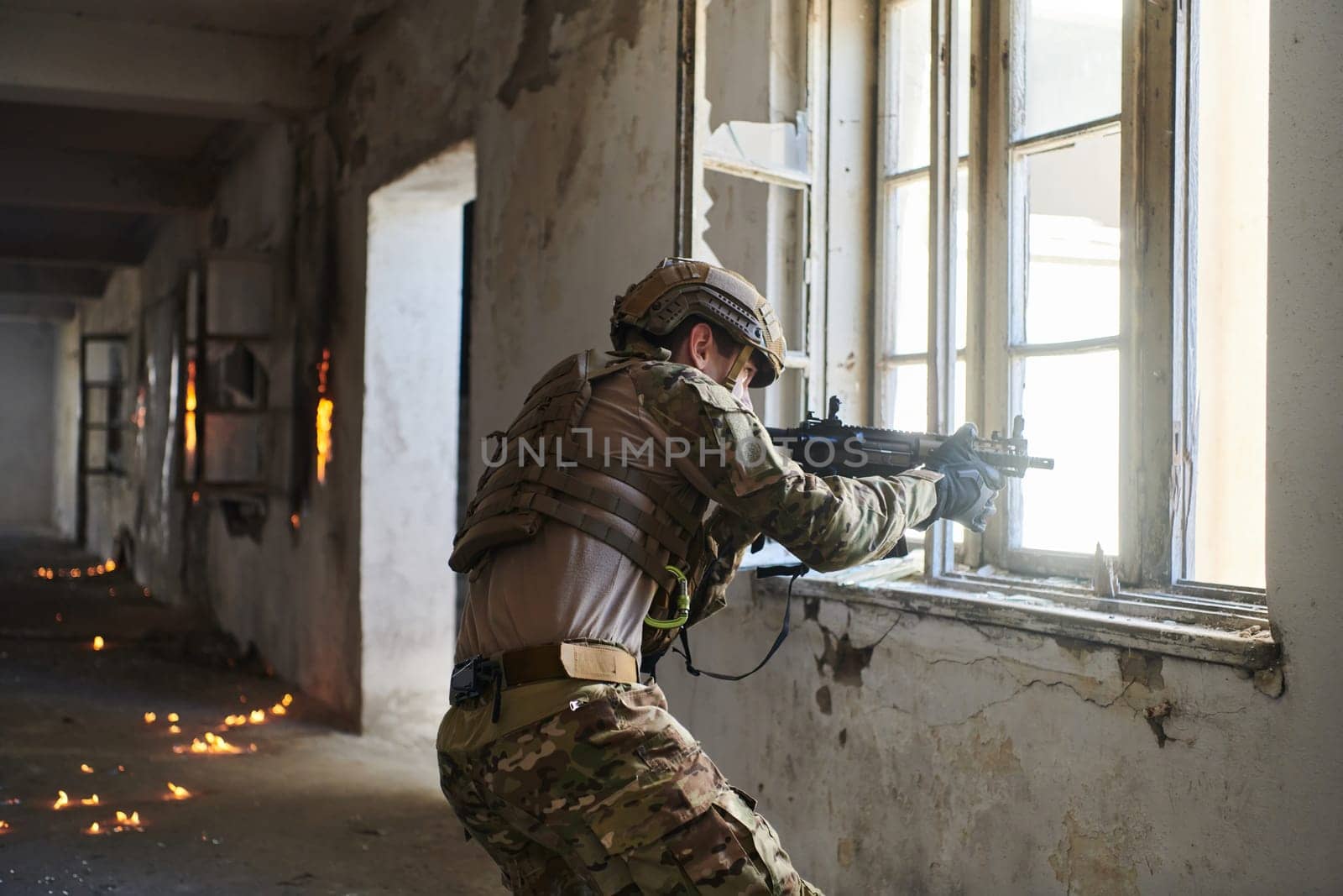 A professional soldier carries out a dangerous military mission in an abandoned building by dotshock