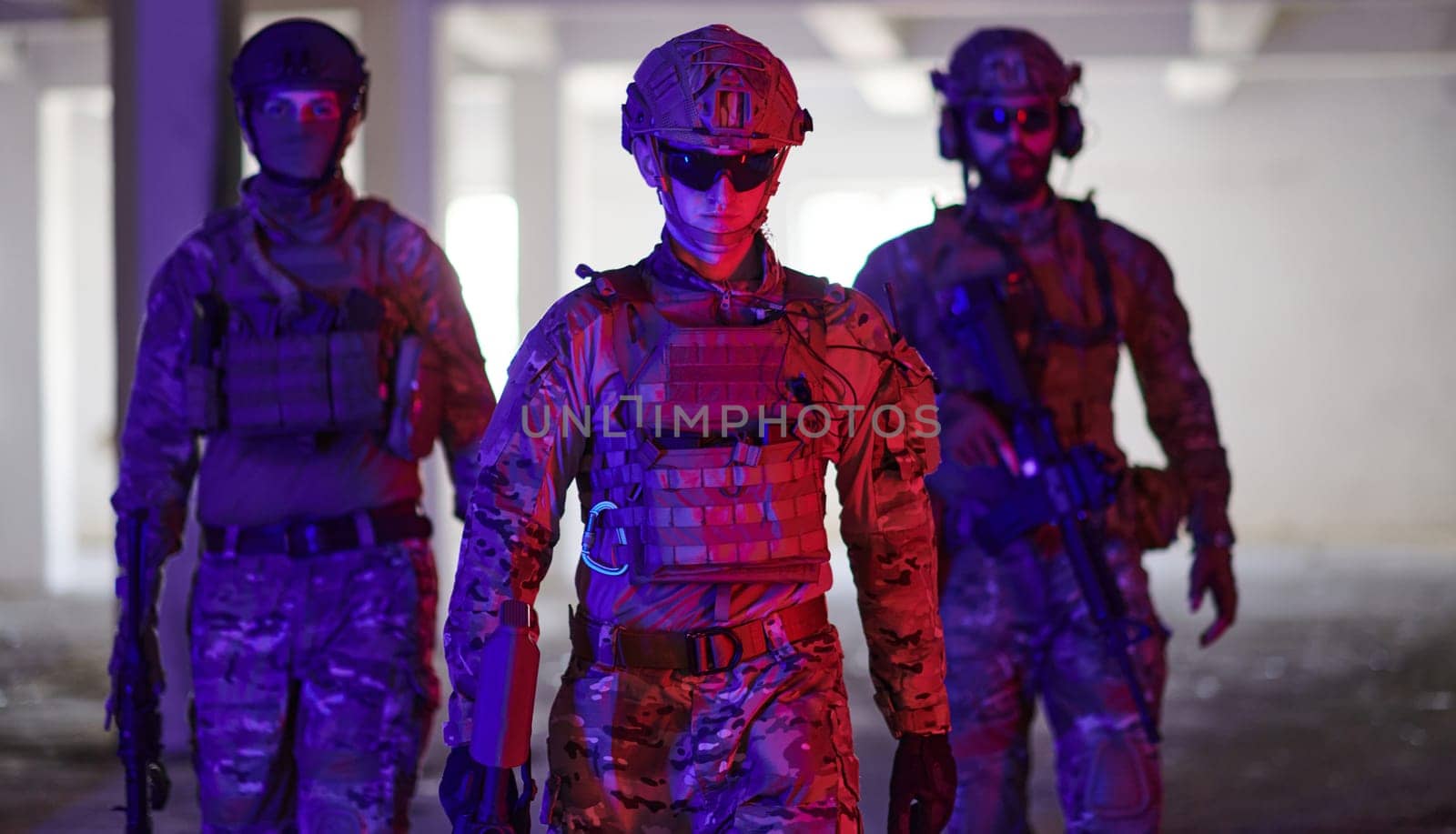 soldier squad team walking in urban environment colored lightis.