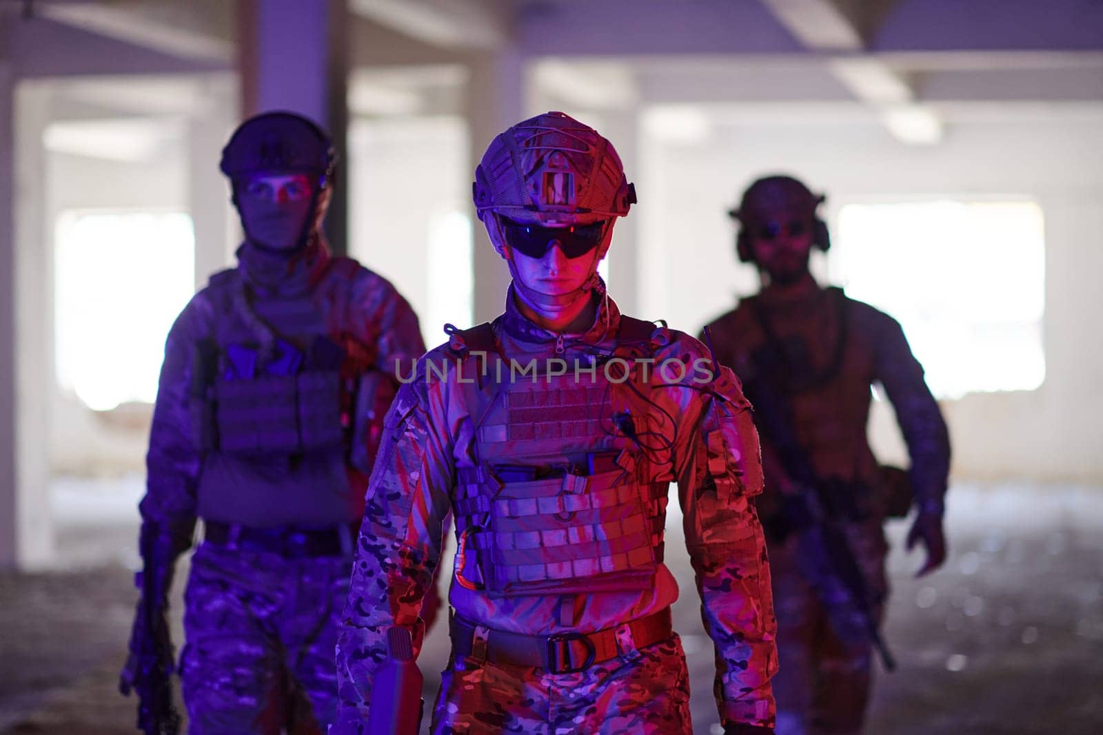 soldier squad team walking in urban environment colored lightis.