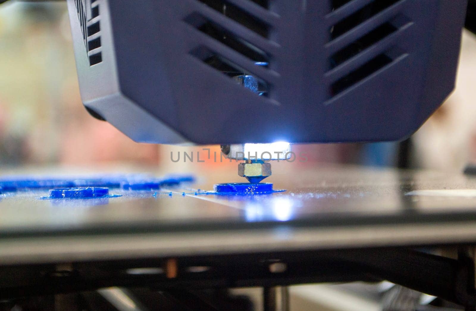 3D printer working close-up. 3D printer prints model from molten plastic close-up. 3D printer printing object. Additive progressive high-tech technology. New modern prototyping technologies.