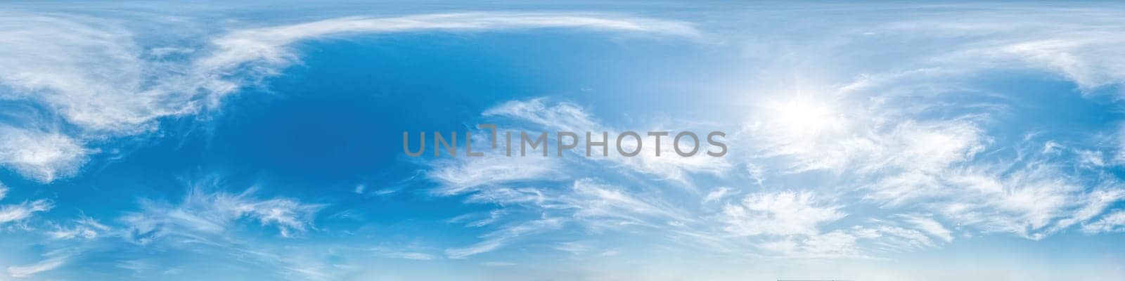 Blue sky with light clouds Seamless panorama in spherical equirectangular format with complete zenith for use in 3D graphics, game and for composites in aerial drone 360 degree panoramas as a sky dome.