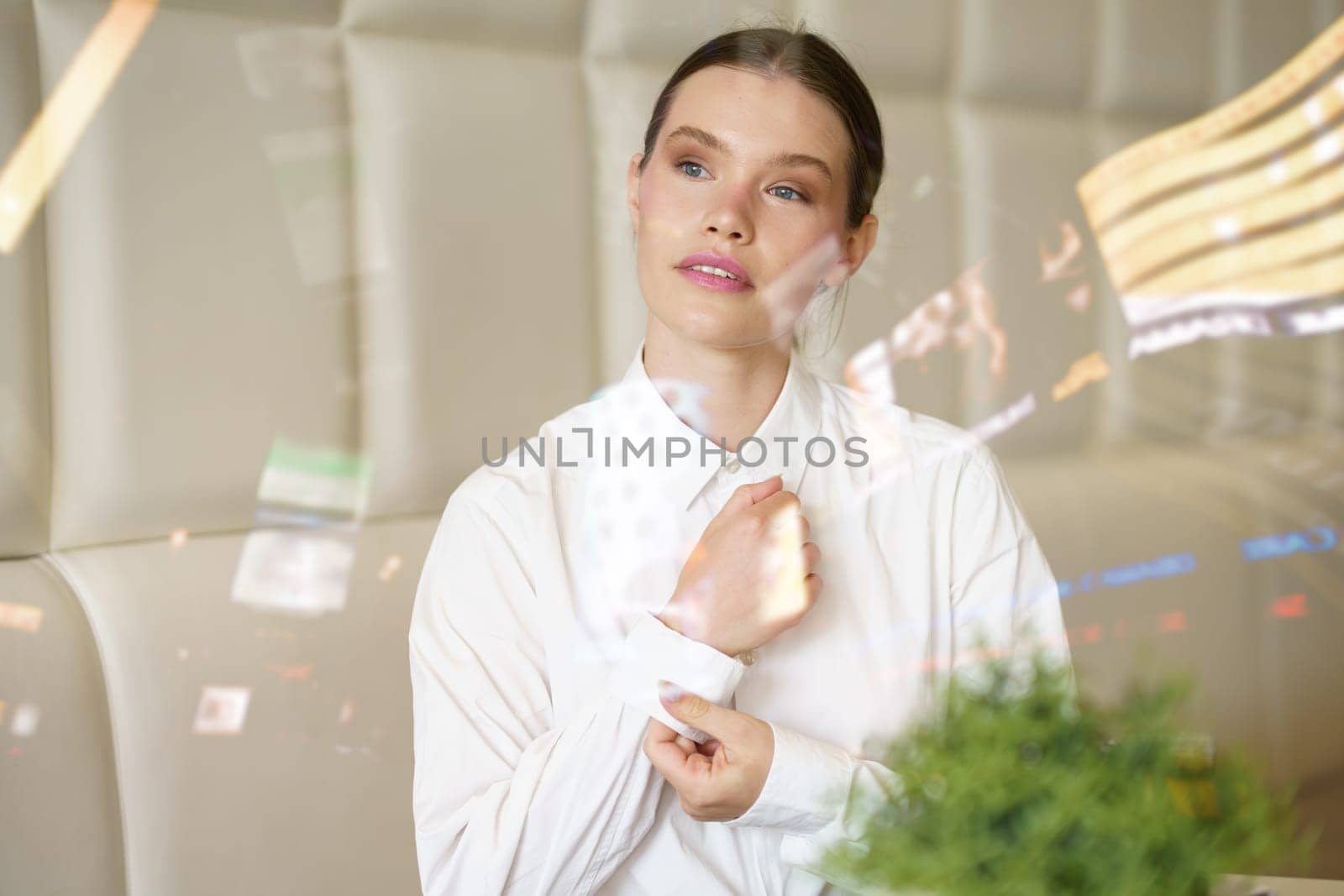 Beauty businesswoman adjusting elegant clothes in a cafeteria by javiindy