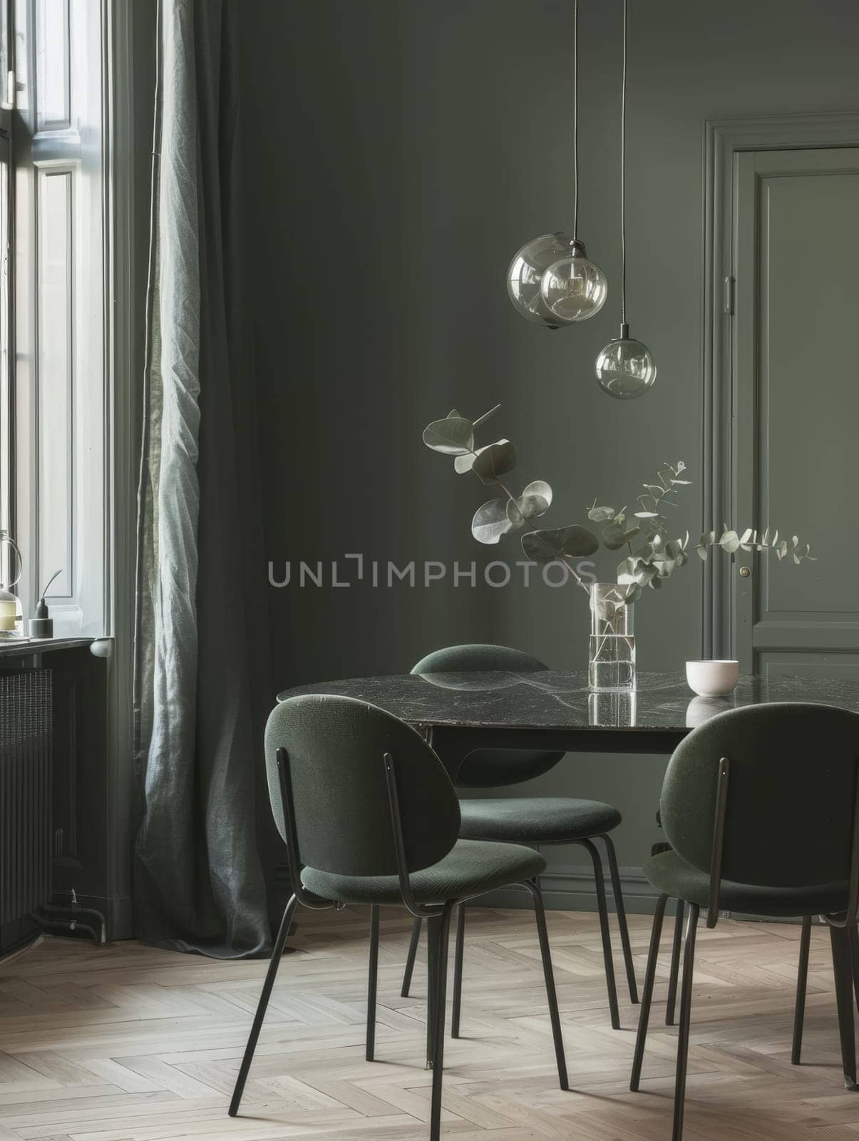 A tastefully decorated green dining room with chic modern furniture and unique pendant lights. by sfinks