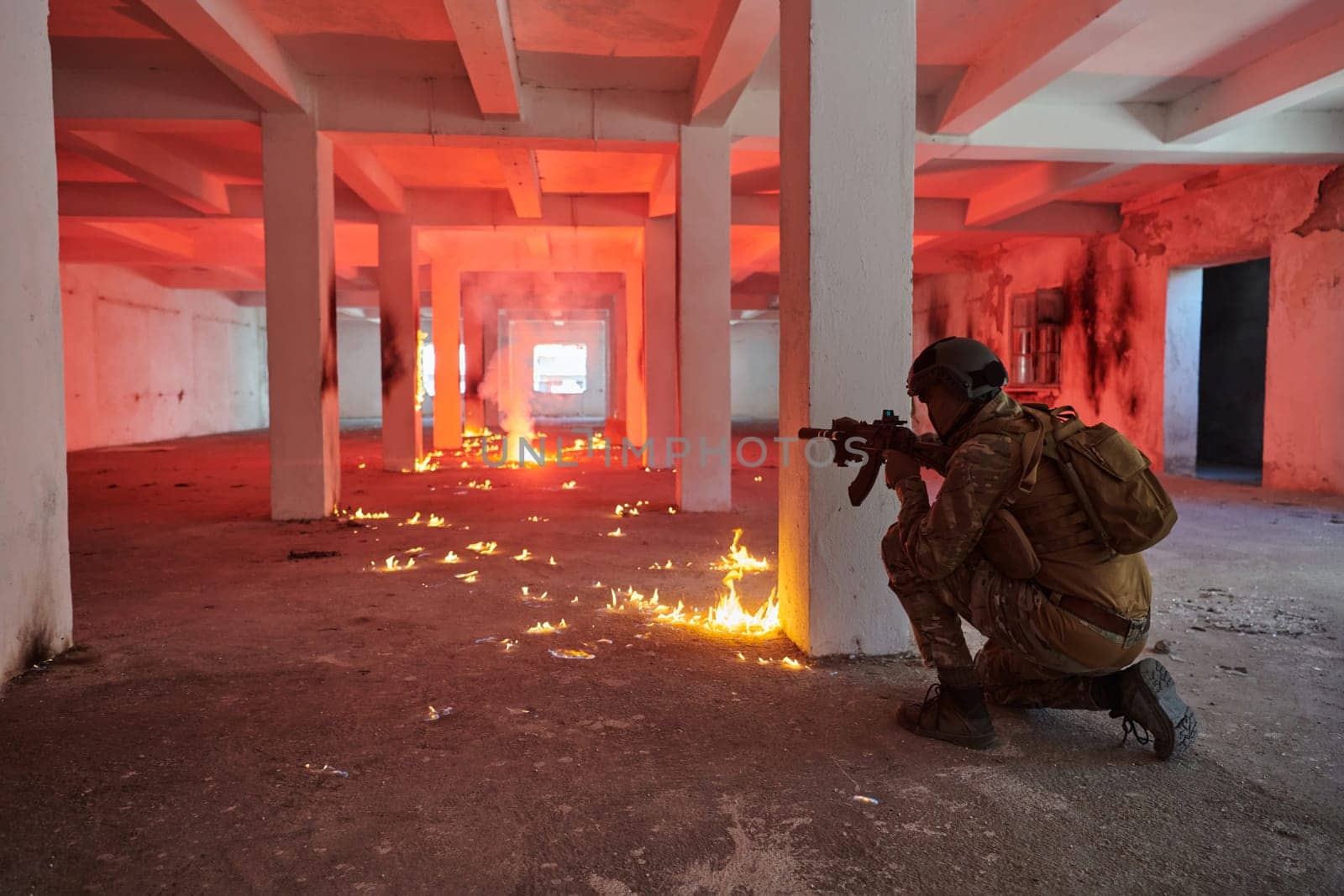 A group of professional soldiers bravely executes a dangerous rescue mission, surrounded by fire in a perilous building