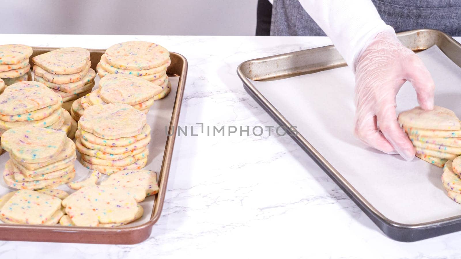 Packing Sprinkle-Adorned Sugar Cookies into Boxes by arinahabich