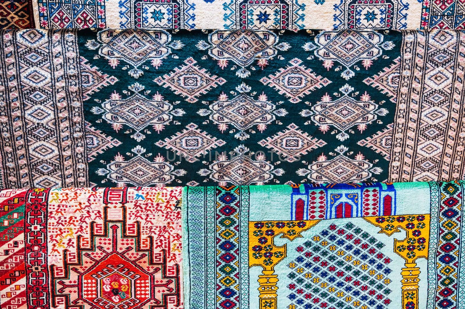 pattern of a traditional Asian carpet at oriental bazaar in Tashkent in Uzbekistan in closeup
