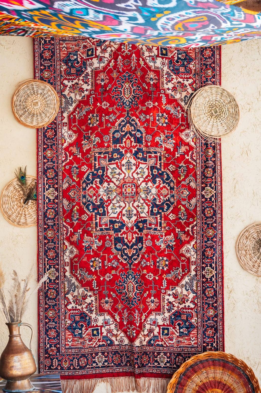 vintage traditional Arabic red handmade carpet at the oriental bazaar in Uzbekistan in Tashkent