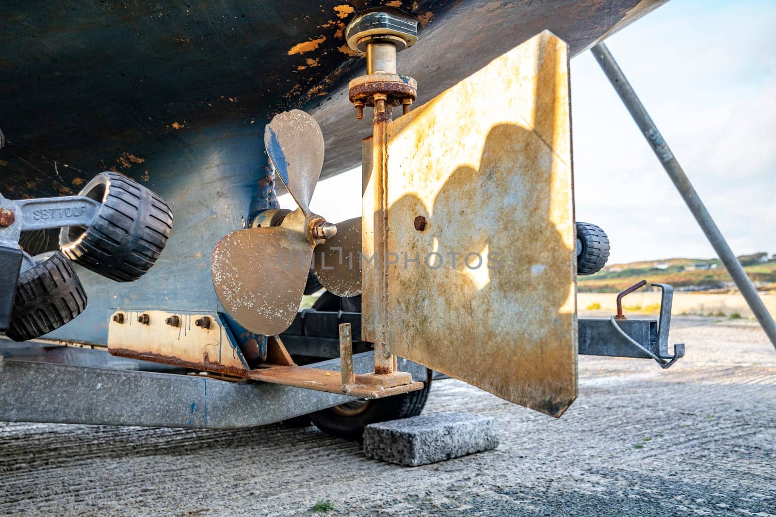 Propeller screw and rudder of vessel at Rosbeg harbour in County Donegal - Ireland