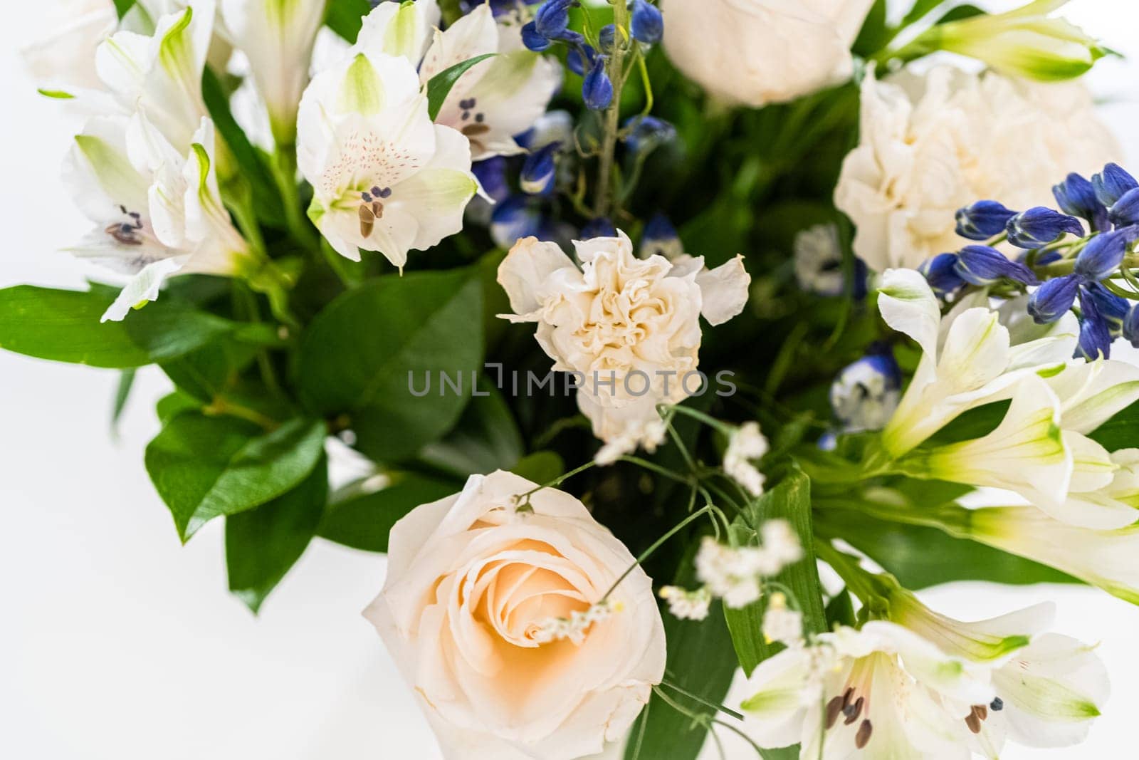 Elegant White Rose Bouquet Adorns a Beautiful Vase by arinahabich