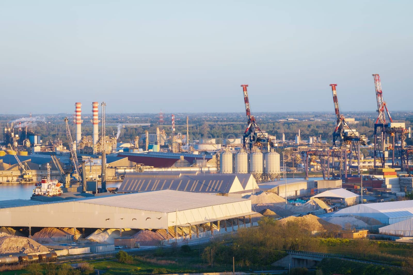 Aerial view of the industrial and port area of Ravenna ,chemical and petrochemical pole,thermoelectric,metallurgical plants and hydrocarbon refinery and liquefied natural gas tanks