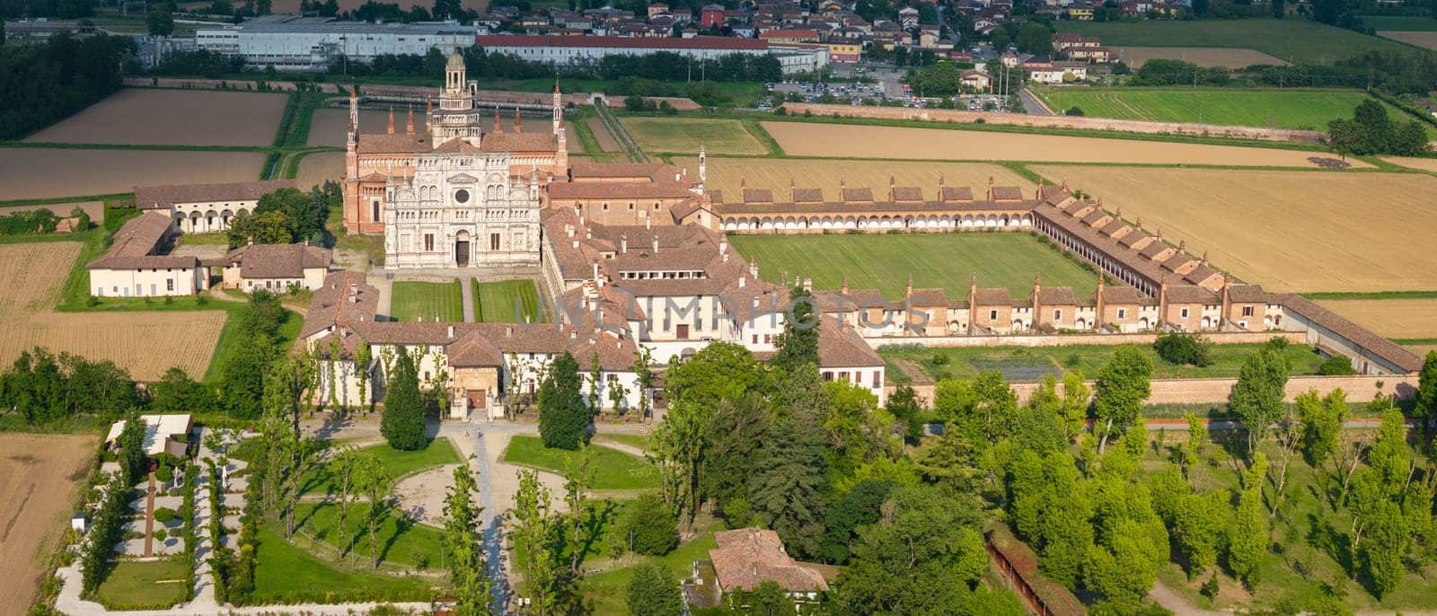 Drone view of Certosa di Pavia abbey at sunny day by Robertobinetti70