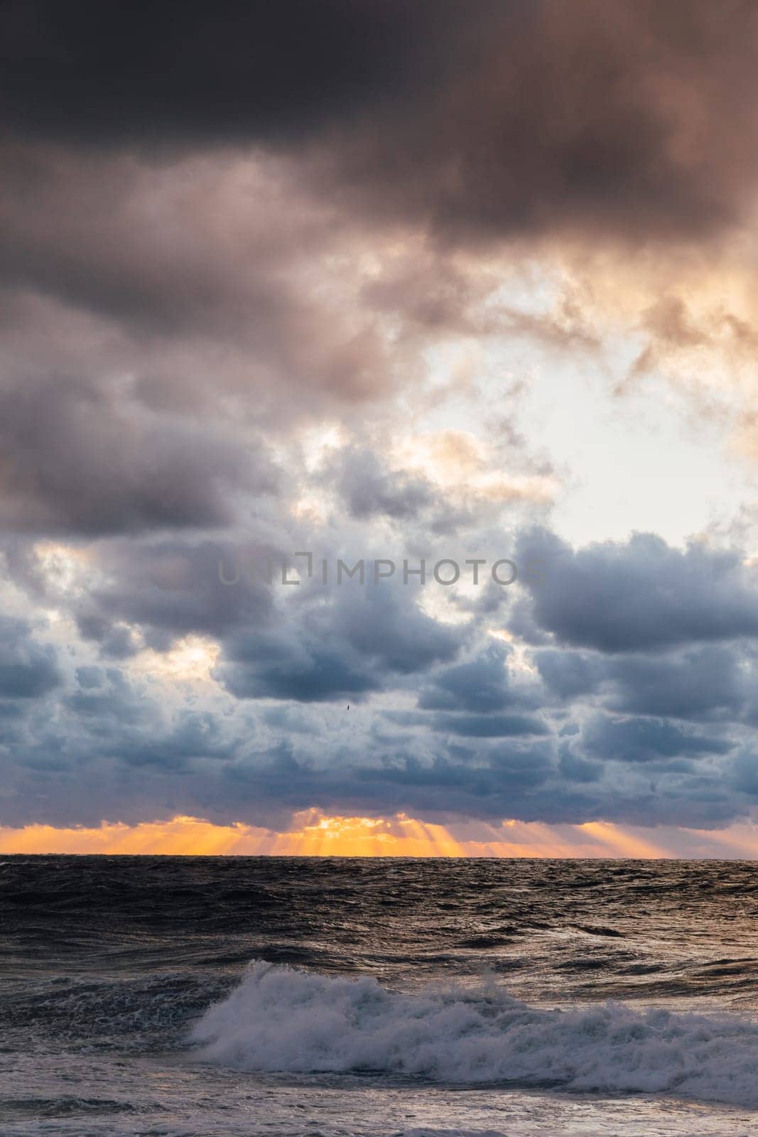 landscape storm on sea and sunset with clouds