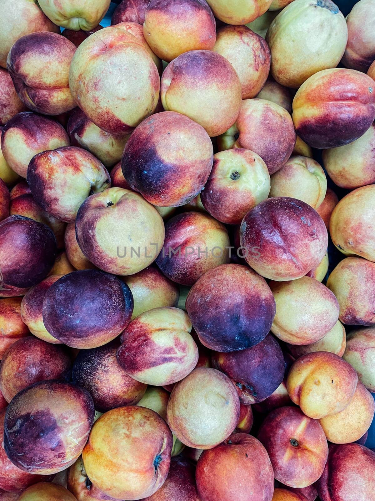 lots of fruit nectarin peaches for food as background