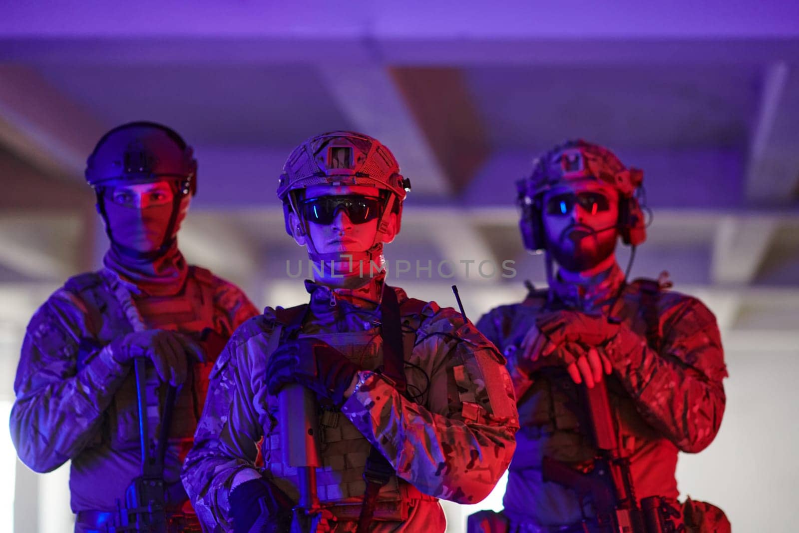 soldier squad team walking in urban environment colored lightis.