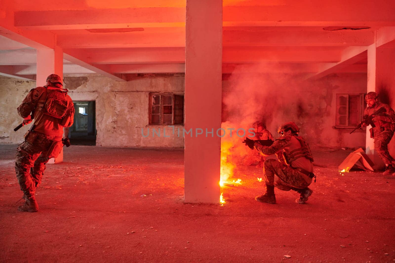 A group of professional soldiers bravely executes a dangerous rescue mission, surrounded by fire in a perilous building