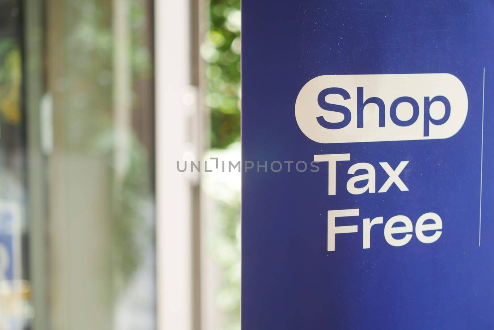 shop tax free text duty free shop sign on shop window ,