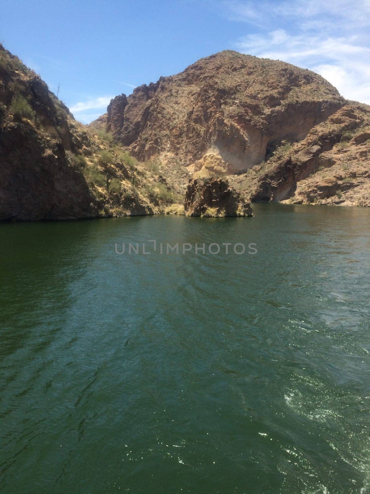 Rugged Rocky Shoreline of Canyon Lake, Arizona. View from Boat. Water recreation in the Arizona desert. High quality photo