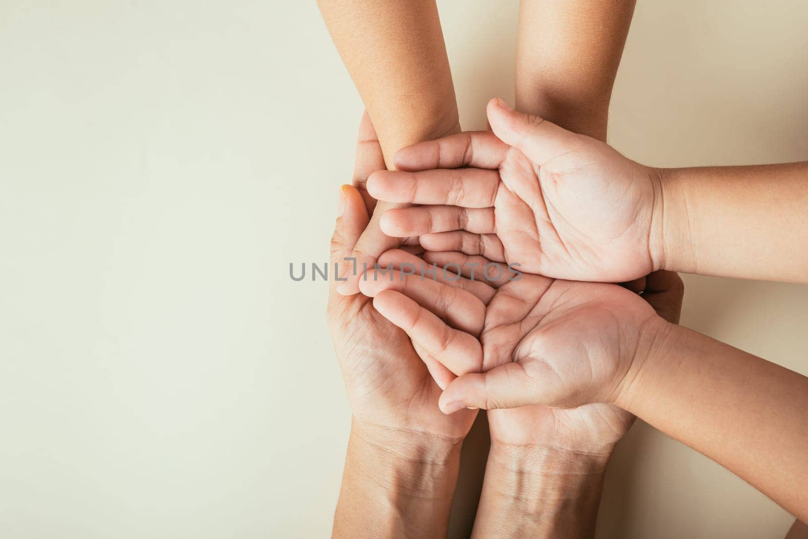 Parents and kid holding empty hands top view isolated. Symbolizing Family Day expressing togetherness support and heritage. by Sorapop