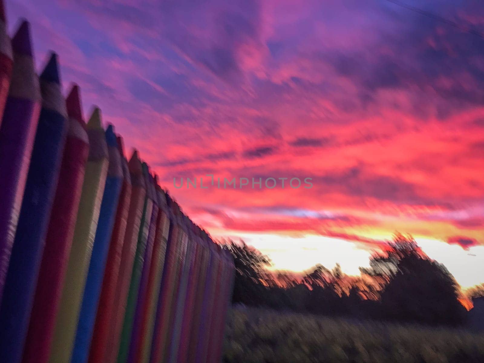 A beautiful image of a school wall in coloured pencils against a blushing evening sky, High quality photo