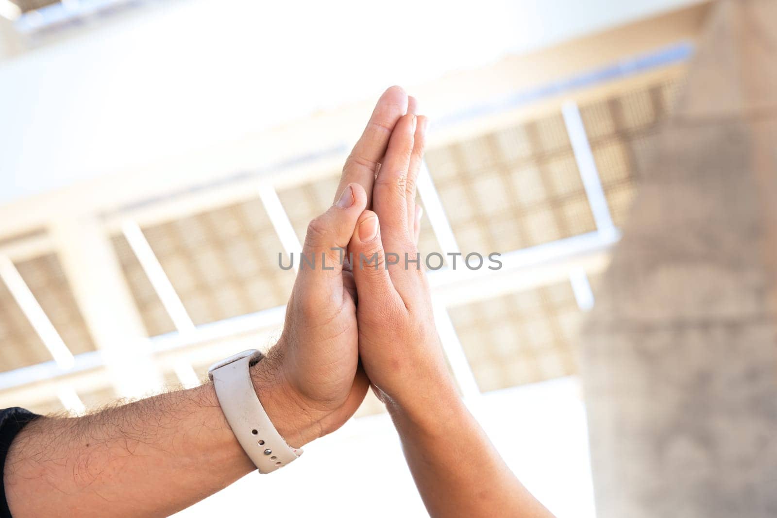 Close-up of two hands coming together, symbolizing trusting each other by molesjuny