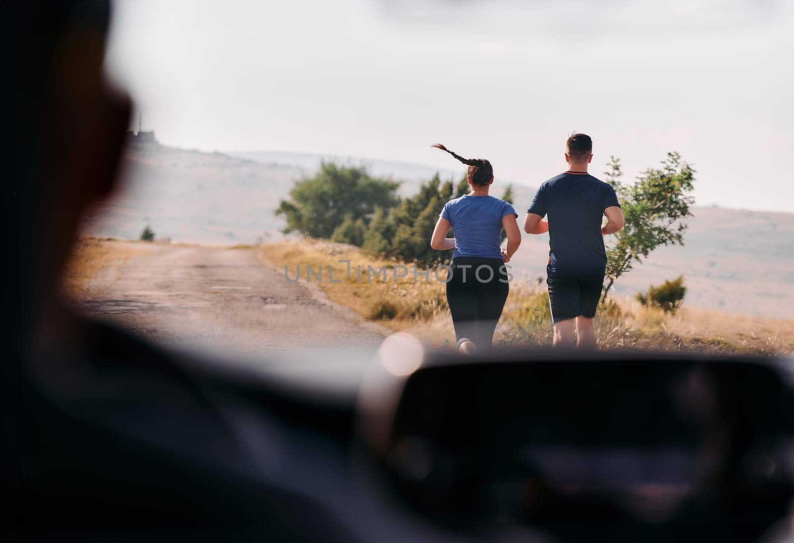 Romantic Couple Running Outside, Captured from Car by dotshock