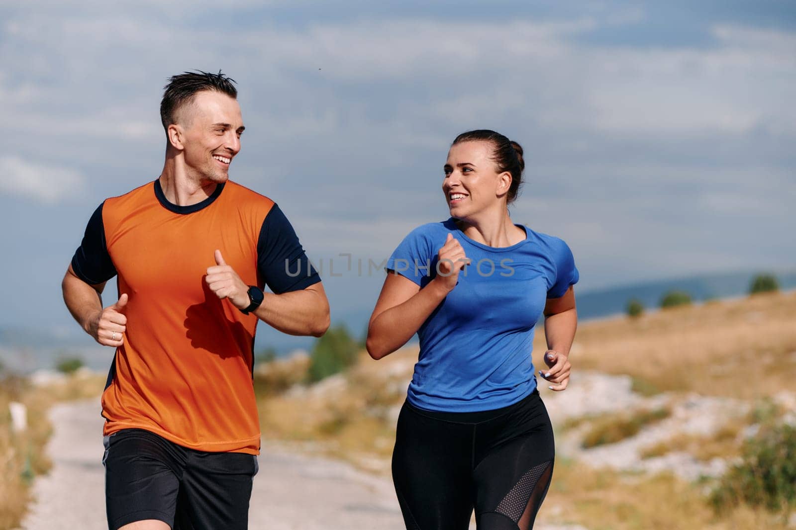 Couple conquer challenging mountain trails during an invigorating morning run.