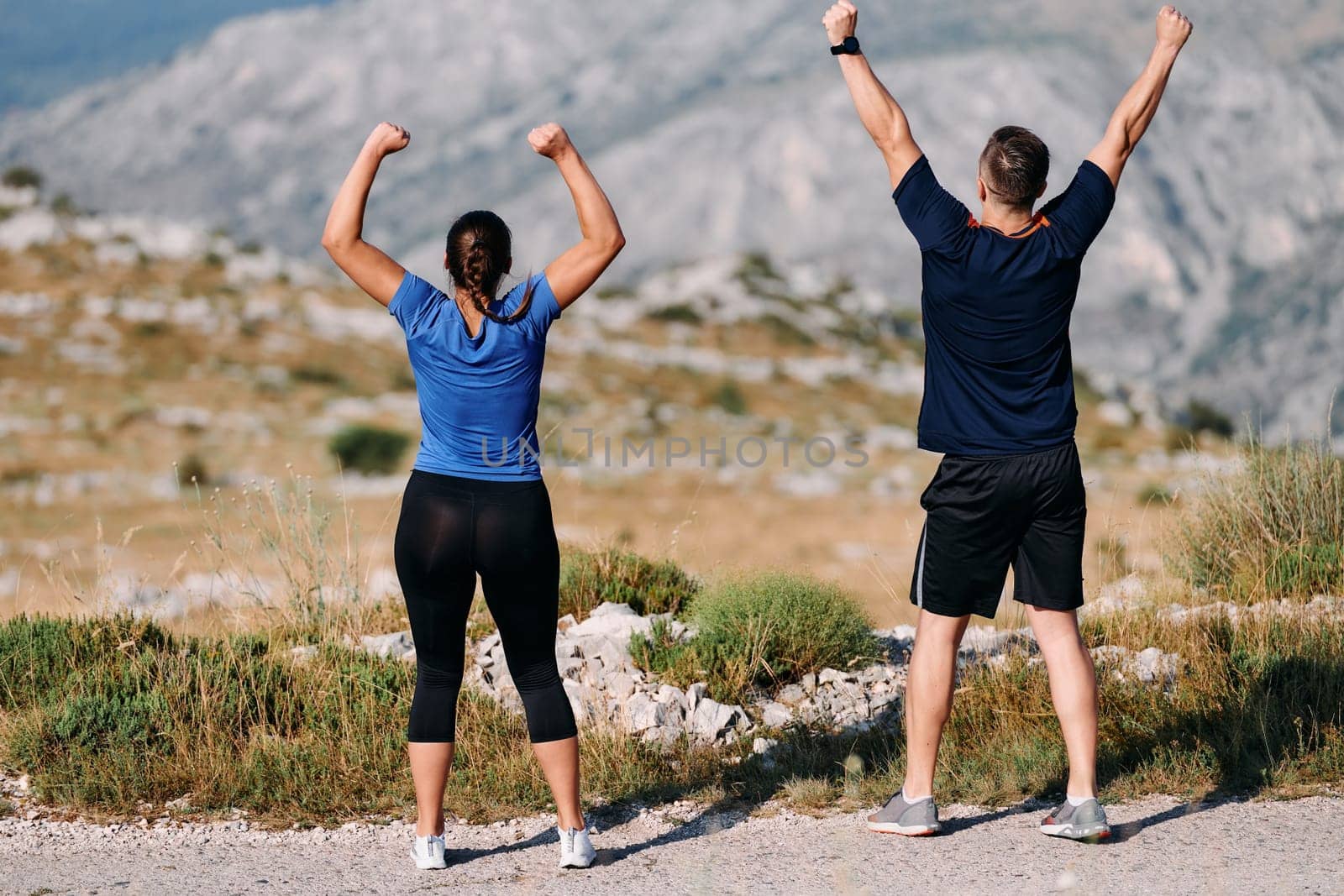 Joyful Couple Celebrating the Successful Completion of a Morning Run. by dotshock