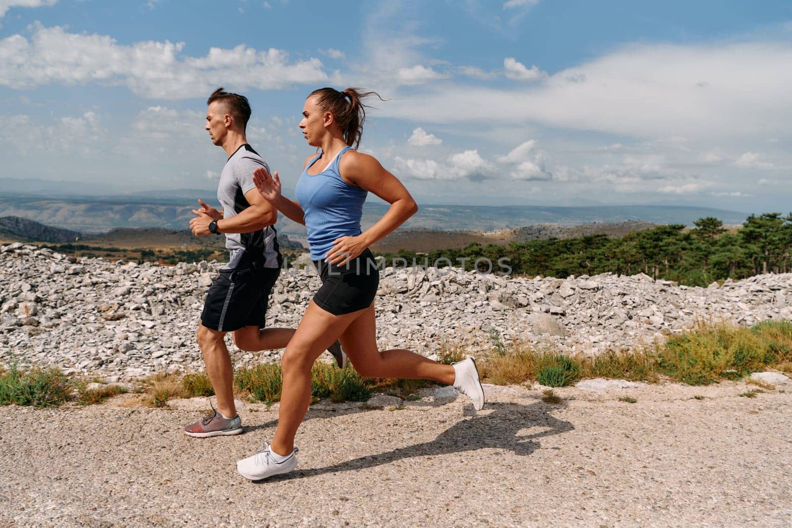 Couple conquer challenging mountain trails during an invigorating morning run.