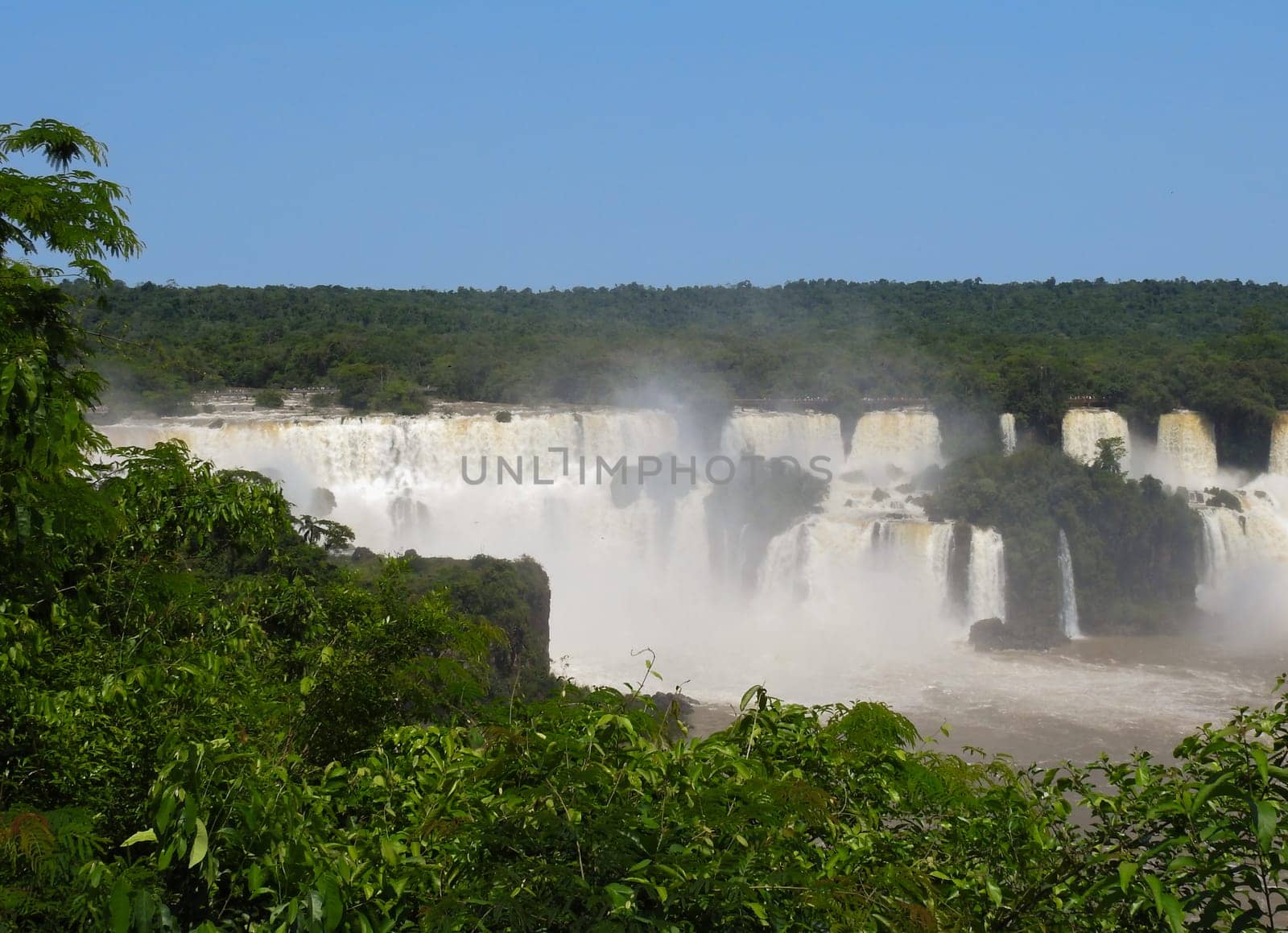 Waterfall at the Iguazu Falls, a wonder of nature. Banner for tourism . Copy space