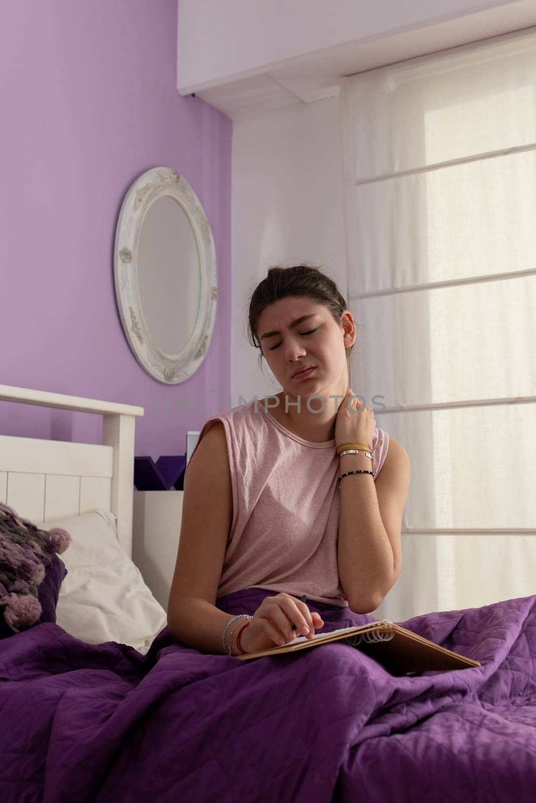 Young woman with neck contracture, trying to stretch. Verical picture