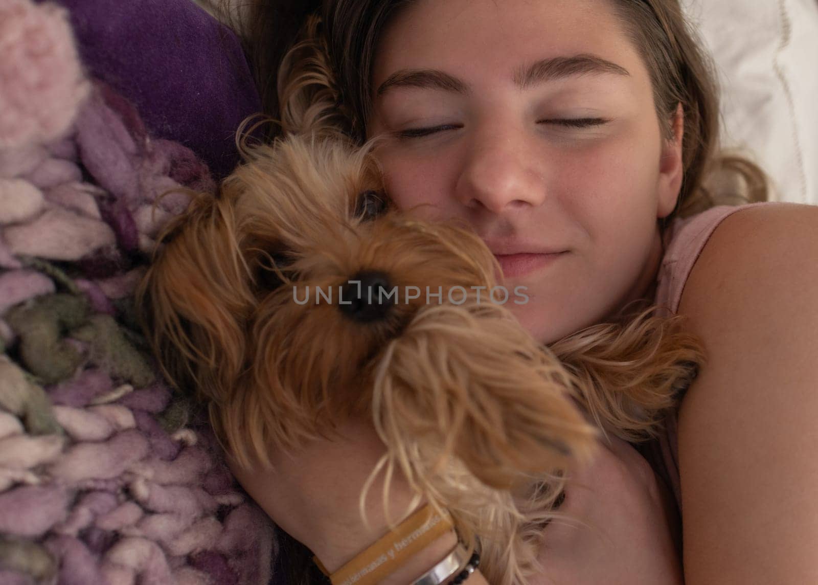 Young girl sleeping relaxed with her dog in her room.Very close up picture. by VeroDibe