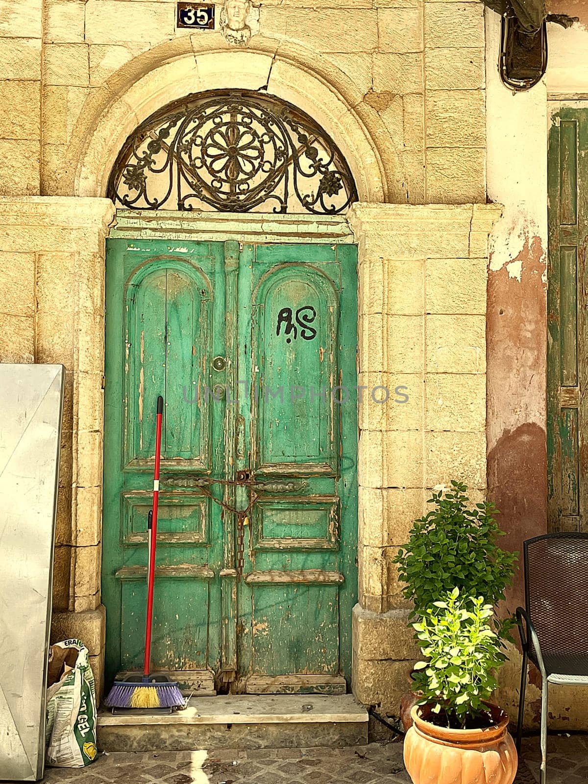 Antique wooden door on narrow streets, old entrance gates by Costin