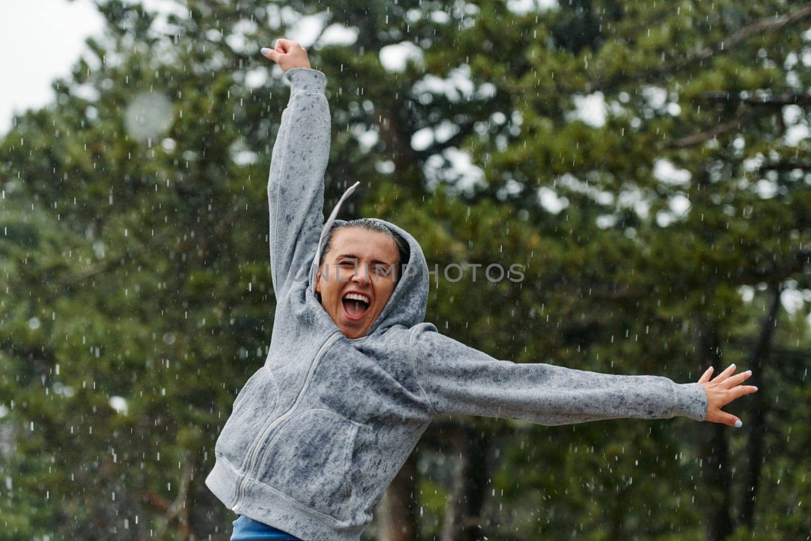 A stunning woman savors the tranquility of a rainy day after a rigorous run, finding solace and rejuvenation in the soothing rhythm of the falling rain.