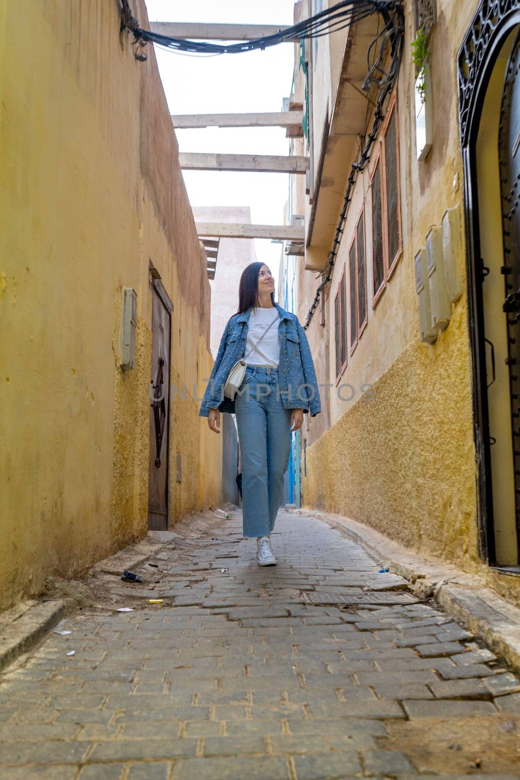 Young woman on the streets of Fez by LopezPastor