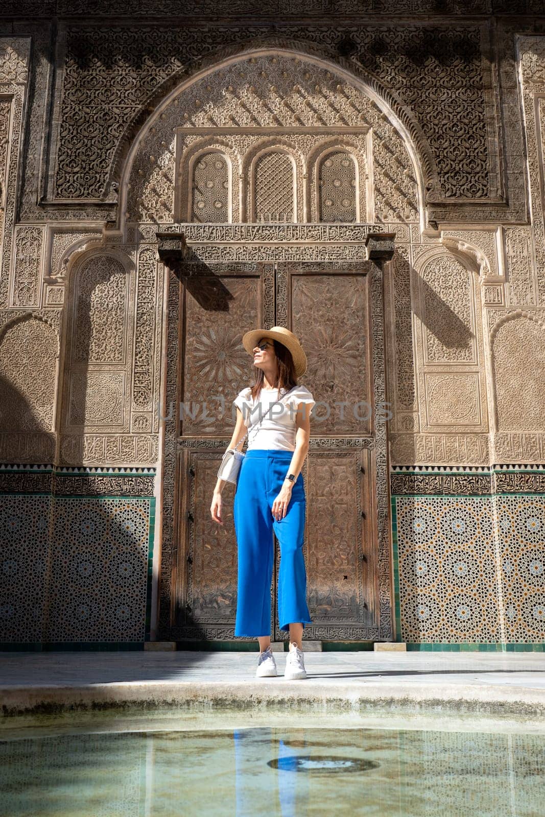 Young Woman in Hat at Bou Inania Madrasa, Fez by LopezPastor