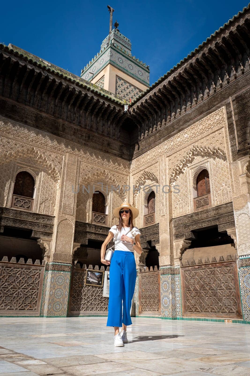 Young Woman in Hat at Bou Inania Madrasa, Fez by LopezPastor