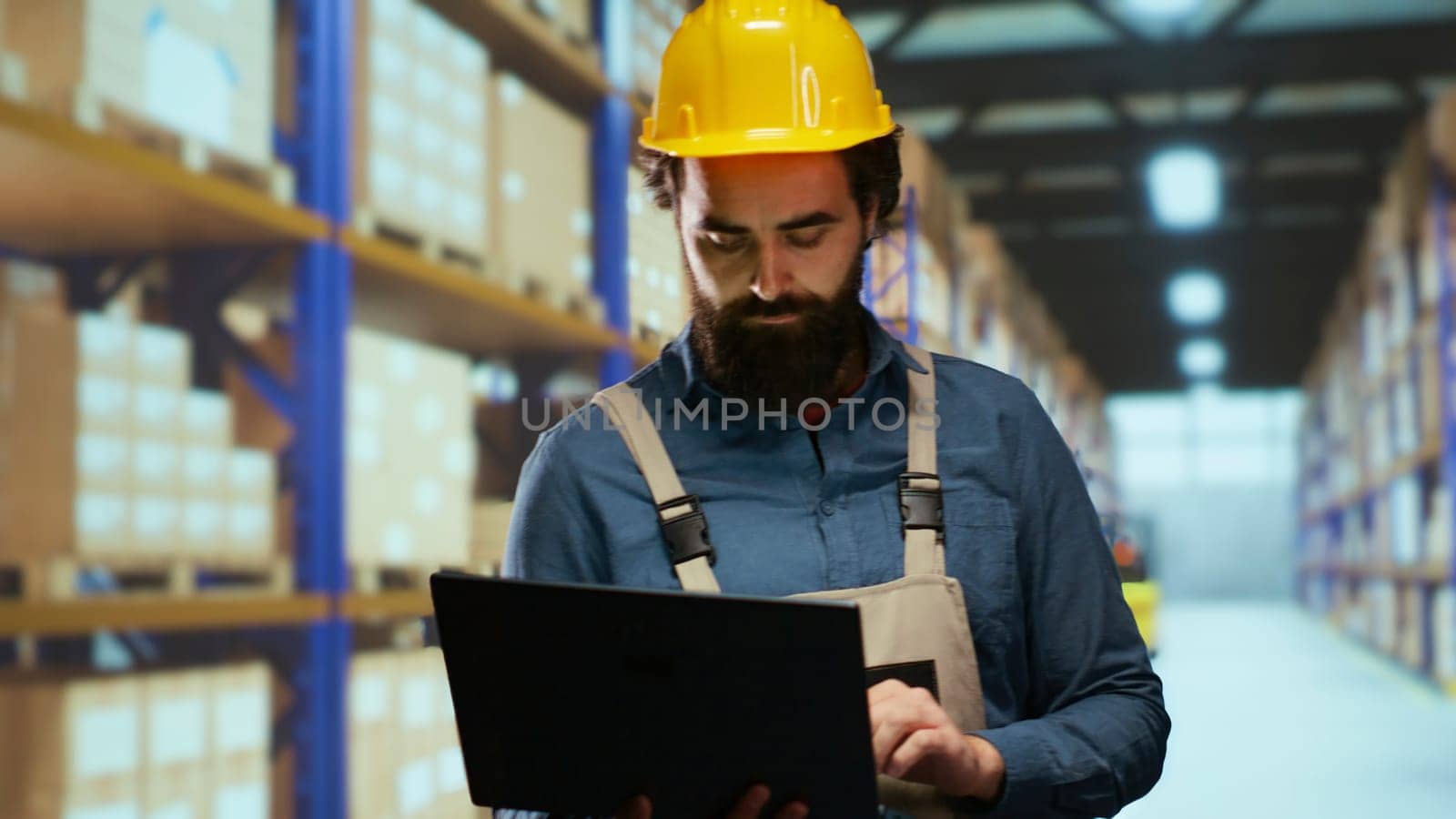 Depot engineer verifying cargo labels and boxes, ensuring shipment and delivery correct details. Warehouse supervisor responsible for staff management and industrial retail activities.