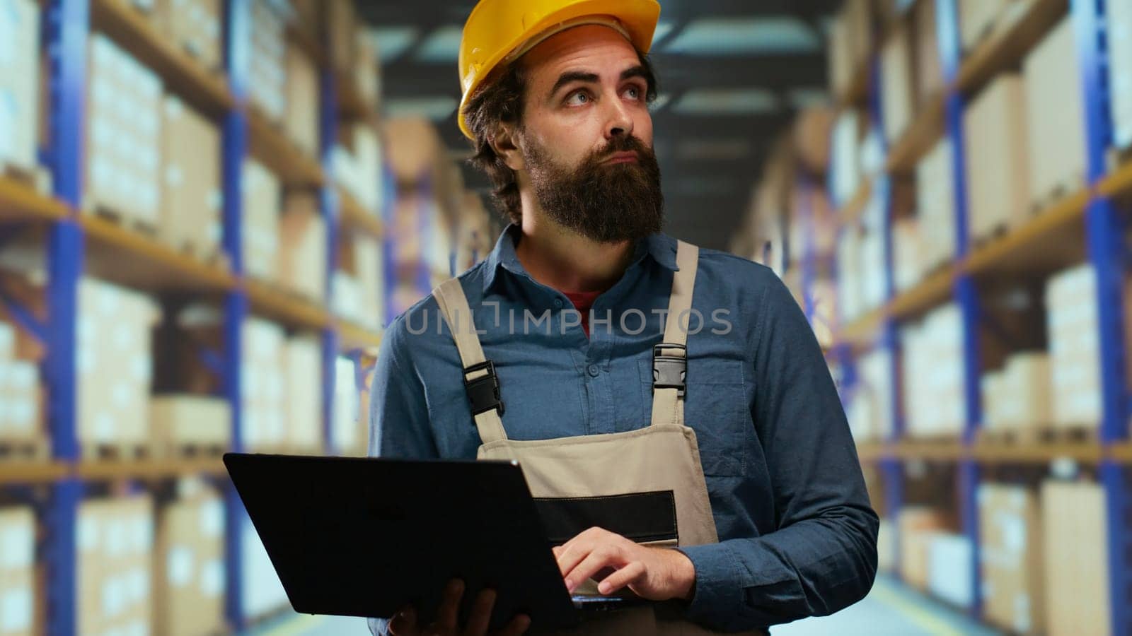 Stocker ensuring warehouse shelves stay stocked and organized, responsible for placing merchandise products in correct location on racks. Manufacturing staff member organizing order contents.