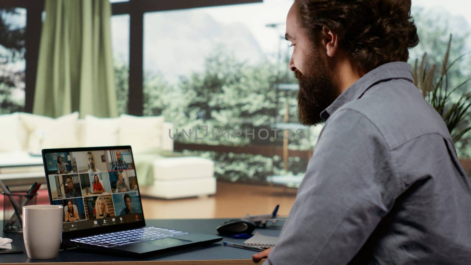 Company CEO meets with shareholders on videocall, attending online connection for new briefing session at his luxurious villa in the mountains. Entrepreneur explaining global strategies to his team.