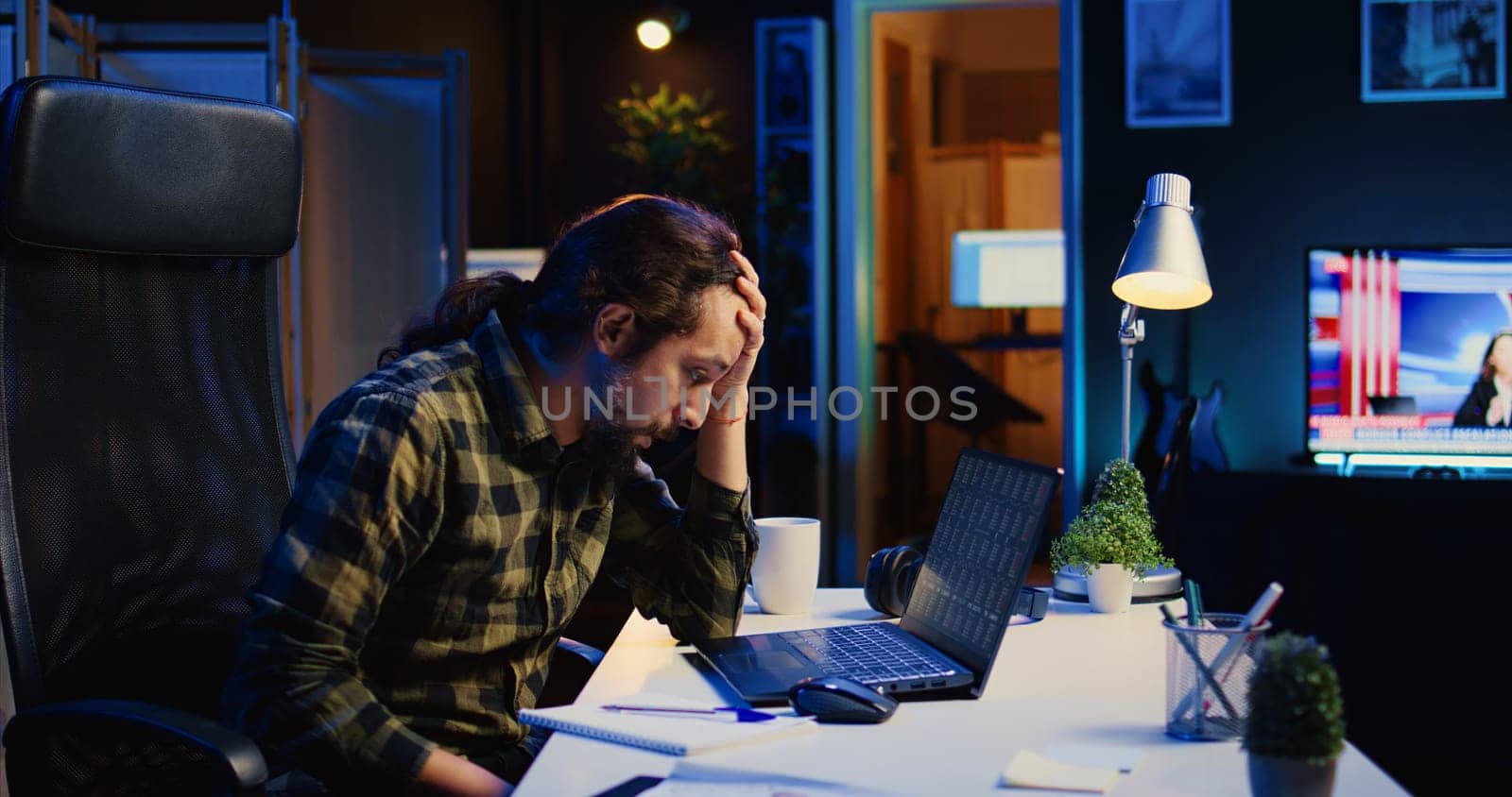 Upset broker investor in home office troubled by low stock exchange valuation, losing money. Freelancer in apartment sighing in frustration after seeing market shares plummeting, camera B