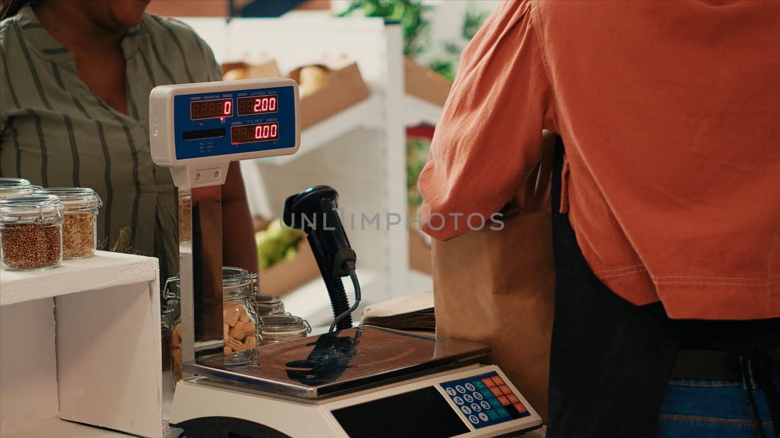 African american customer preparing to buy organic produce from local supermarket, supporting sustainable lifestyle and small business vendor. Buyer approaching checkout counter.