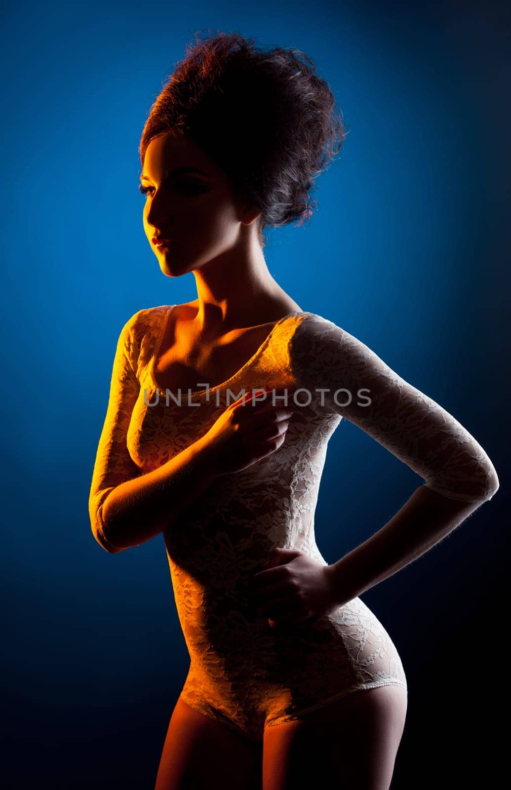 Underwear. Studio shot of sexy model posing in spotlight