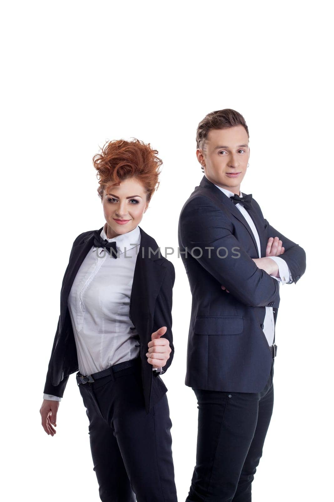 Studio photo of young business people looking at camera