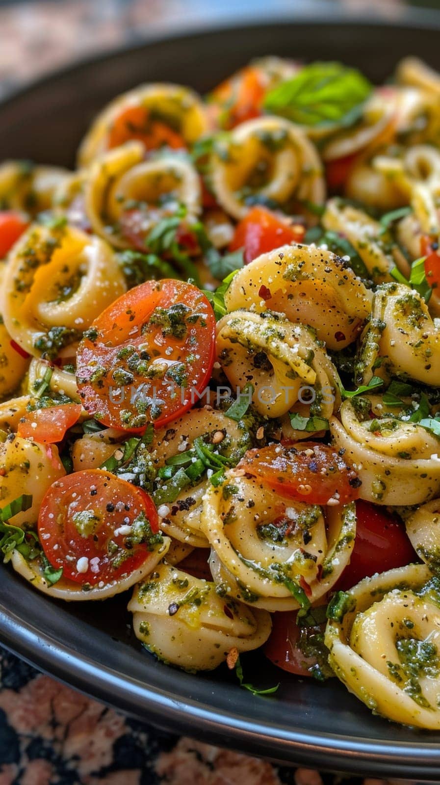 Close up of pesto tortellini bowl of fresh pasta.