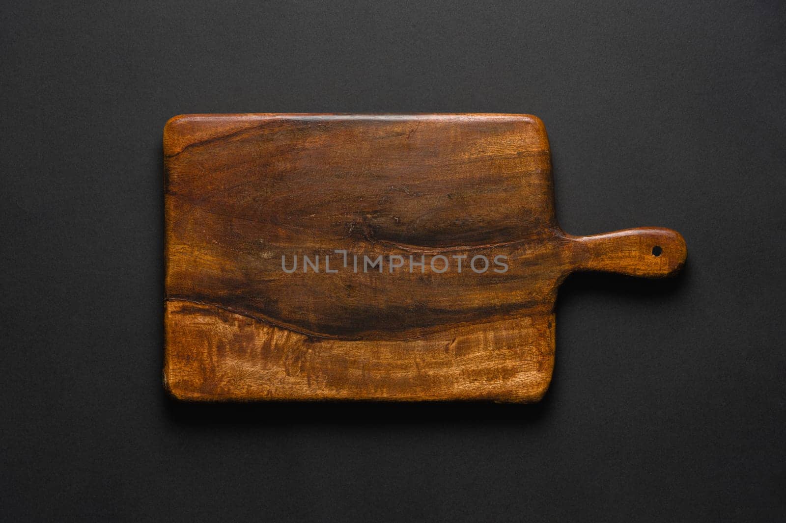 Top view of cutting board on dark gray background