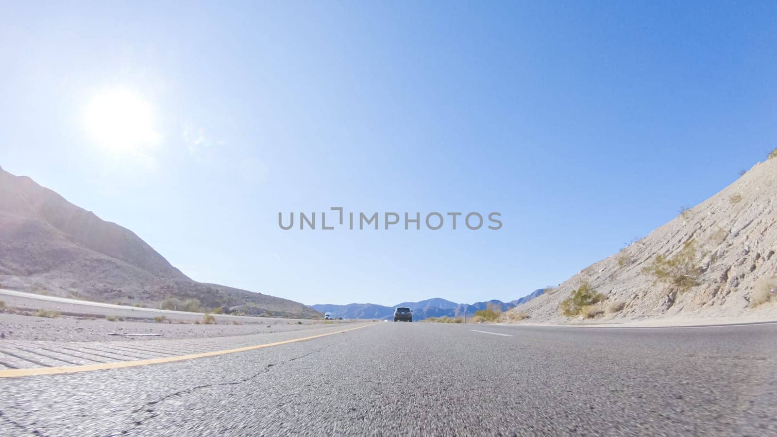 Embarking on a road trip from Nevada to California, driving on Highway 15 during the day offers scenic views and an exciting journey between states.