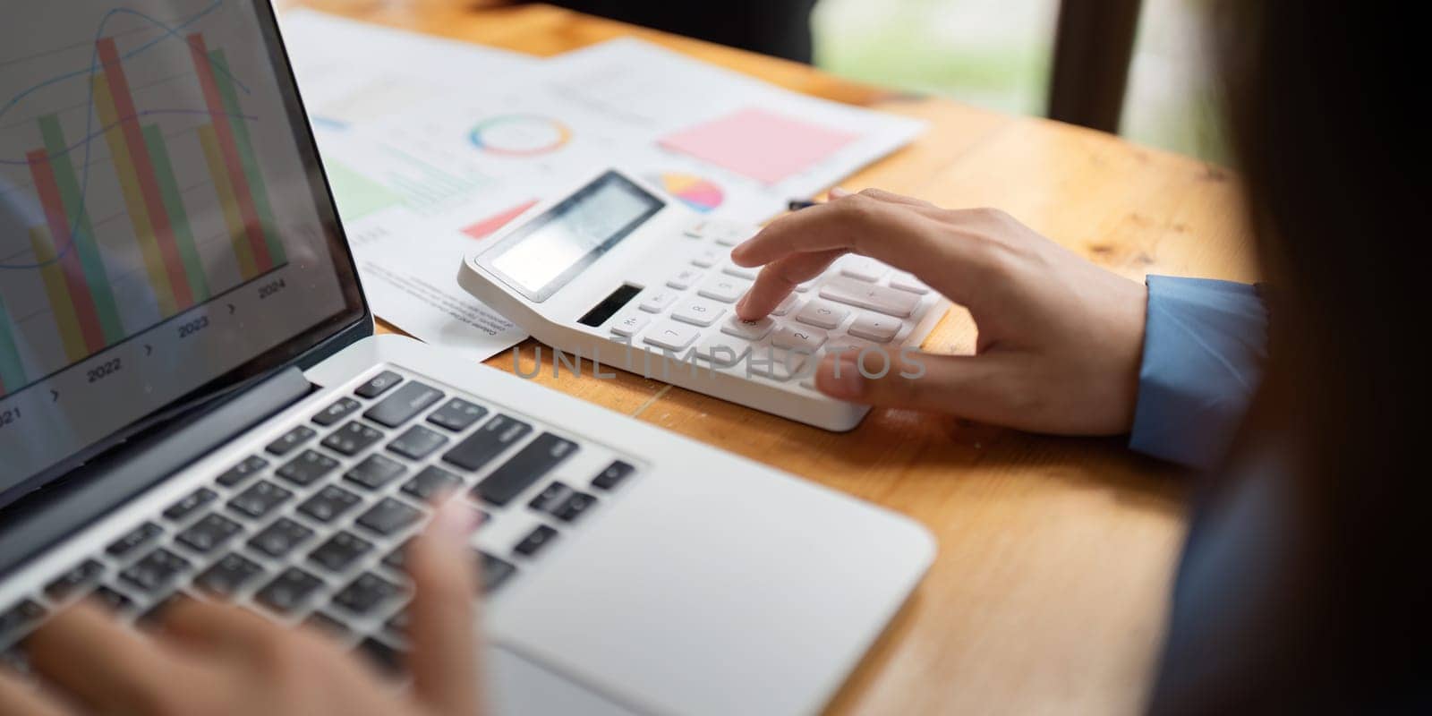 Accountant Using Calculator and Laptop, Concept of Financial Accounting.