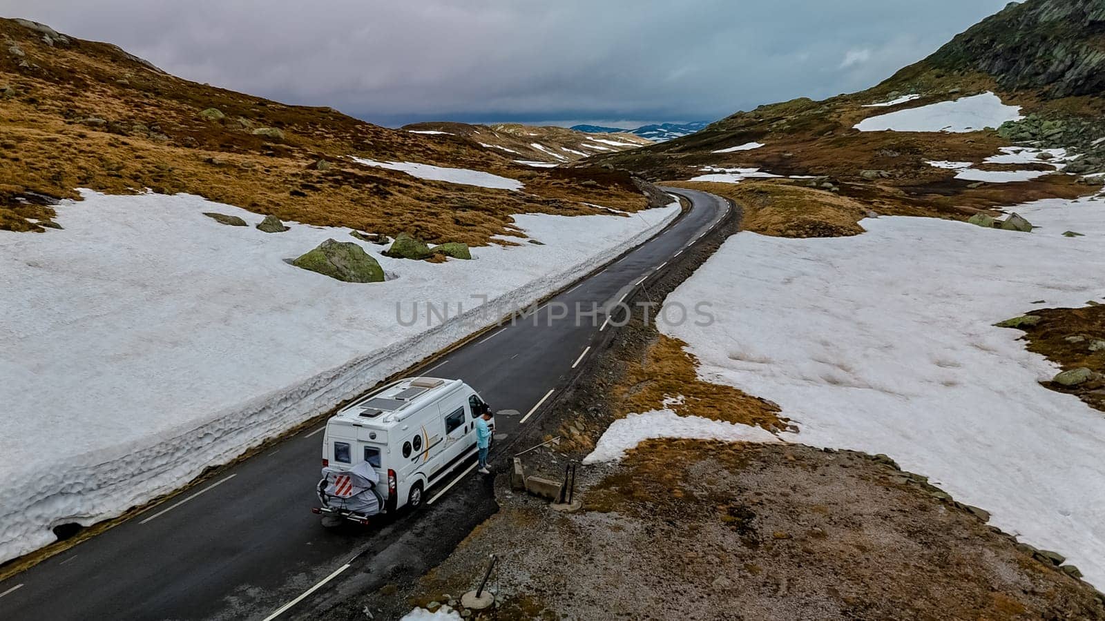 Campervan or motorhome camper van at the Lyse road covered with snow to Krejag Norway by fokkebok