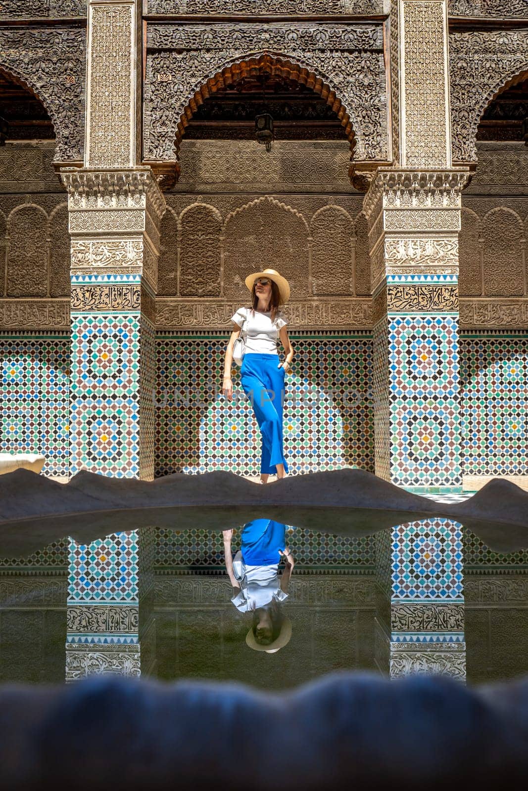 Young Woman in Al Attarine Madrassa, Stylish Visitor in Fez's Historic Site by LopezPastor