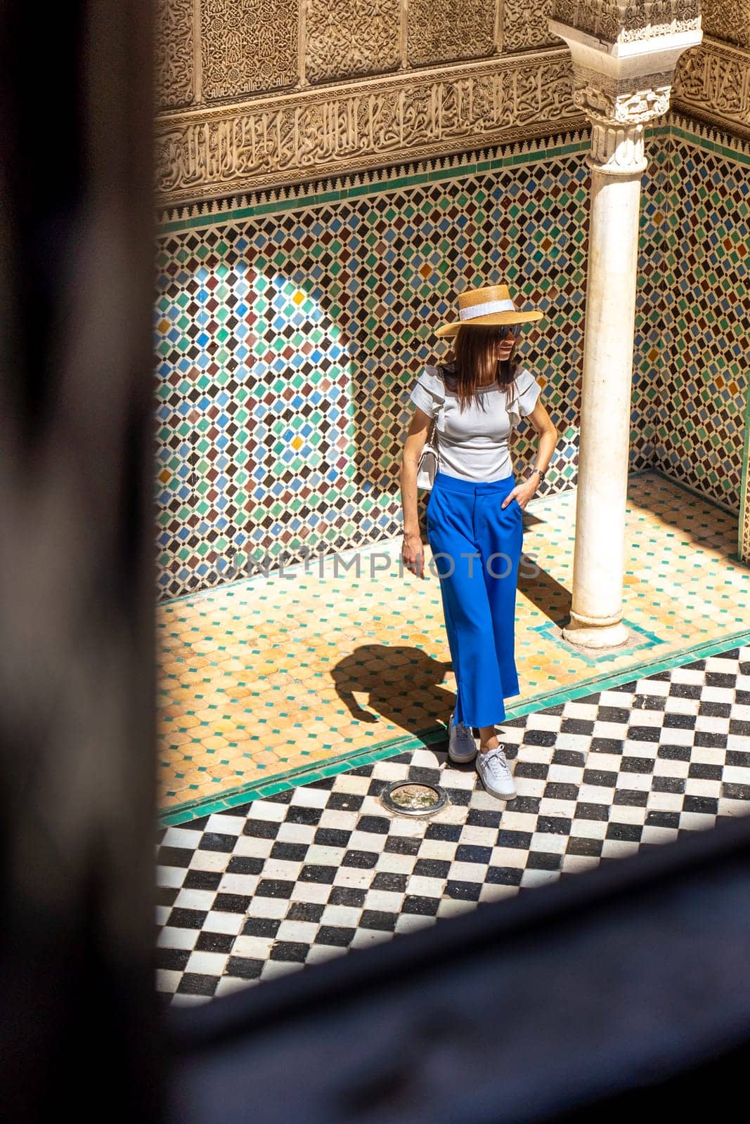 Young Woman Viewed from Above in Al Attarine Madrassa, Fez's Architectural Gem by LopezPastor